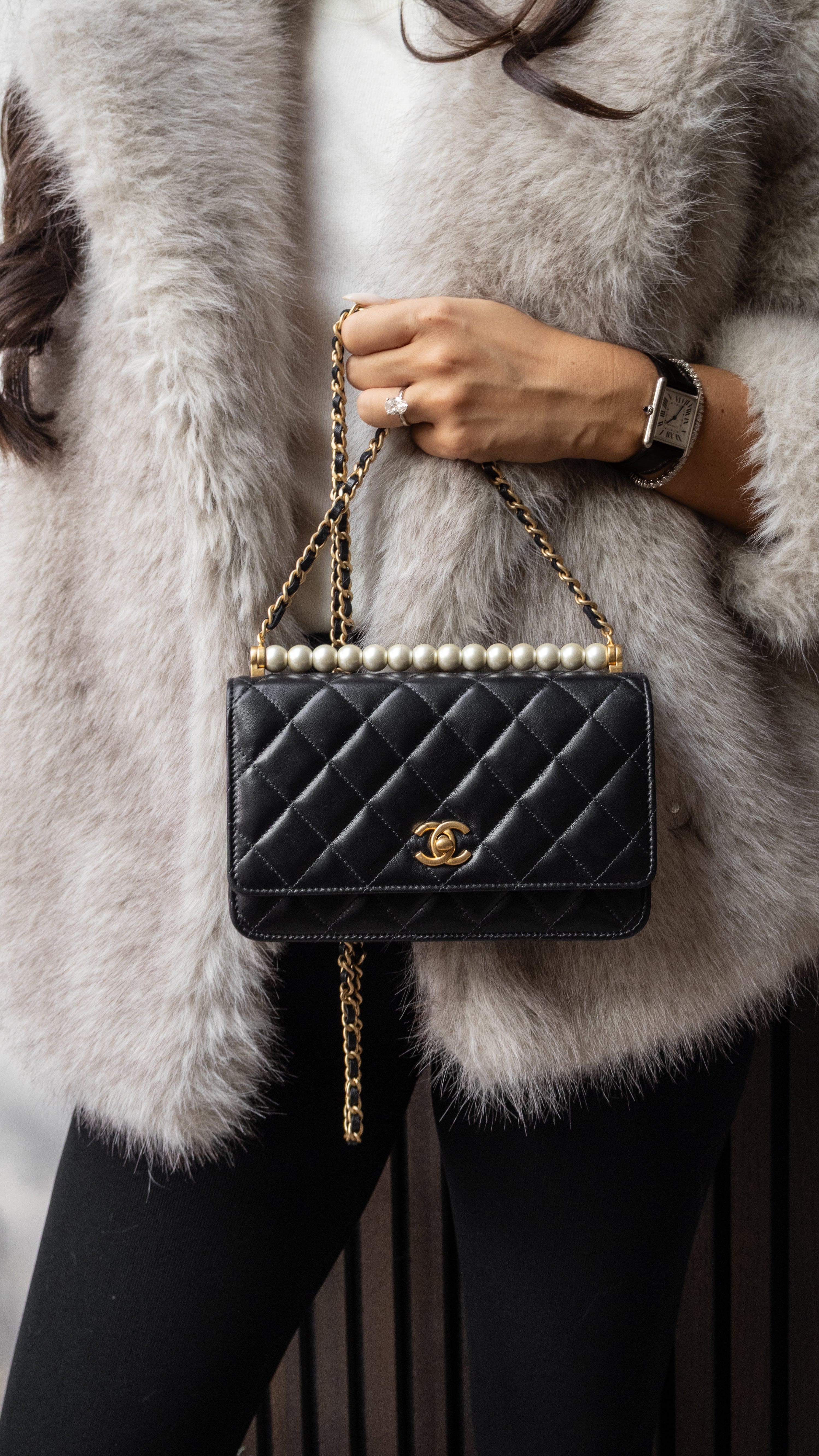 Multiple vintage Chanel bags on cotton bed sheets like a designer bag heaven black lambskin bags with 24k gold hardware authentic