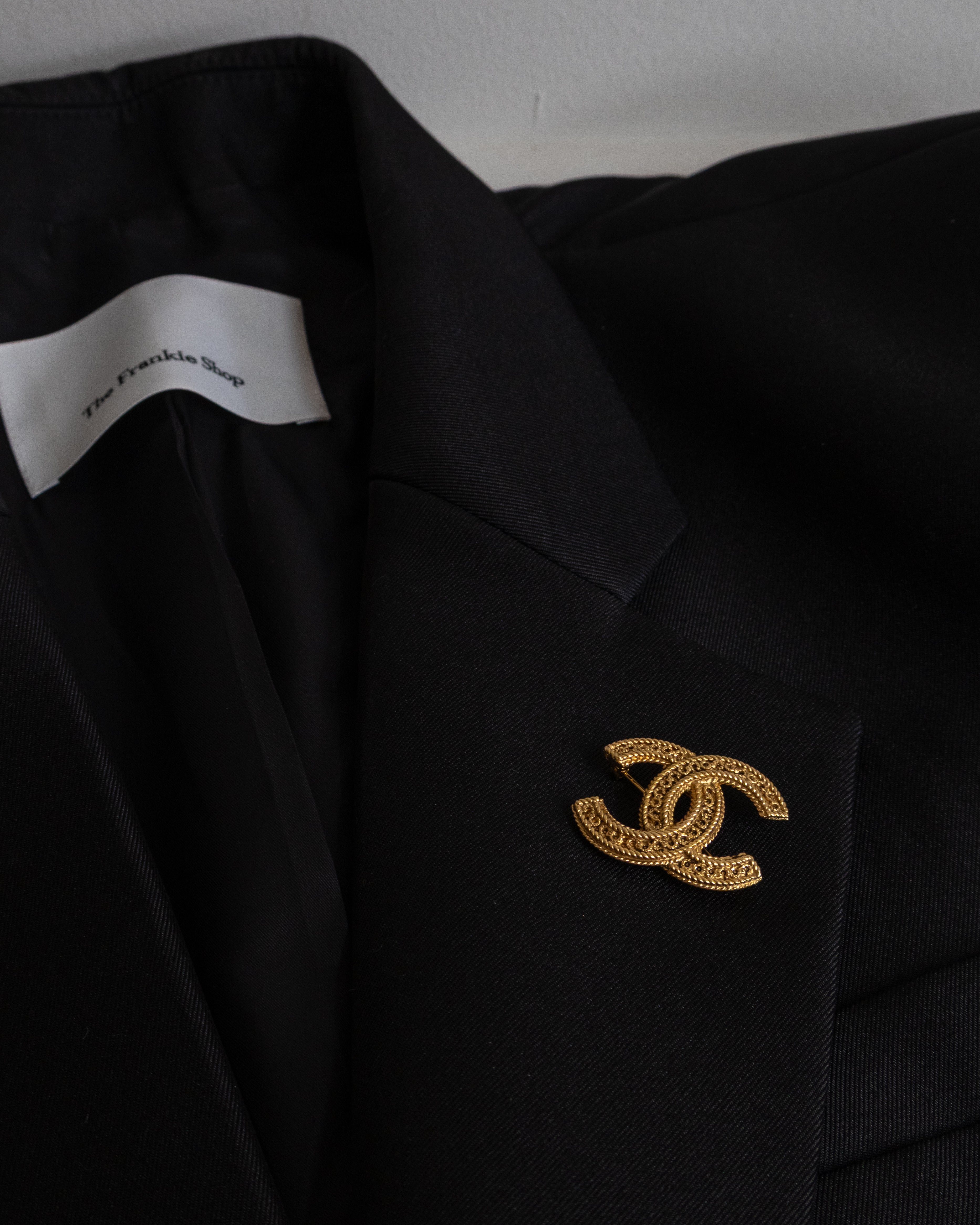 vintage chanel broche gold on blazer